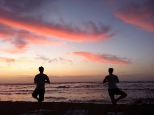 Sunrise yoga on the beach in Kauai, HI